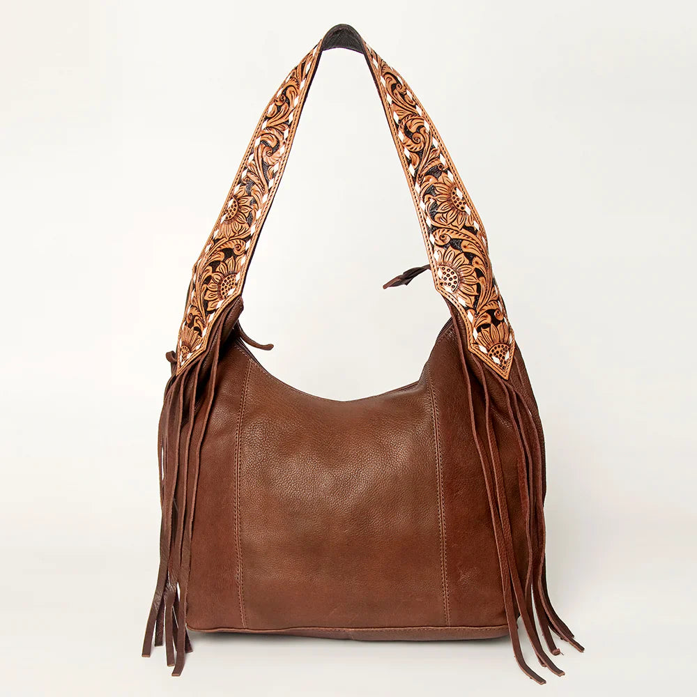American Darling Hobo leather bag with fringes and adjustable hand-tooled strap.