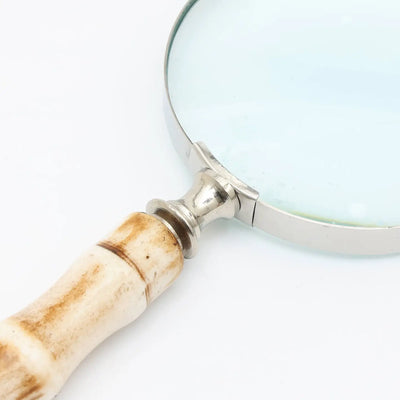 Decorative magnifying glass with smooth resin handle and silver electroplated steel frame, ideal for reading and stylish desk décor