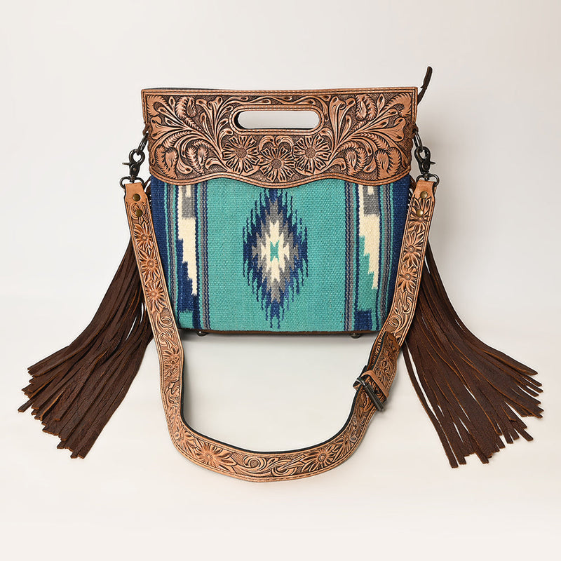American Darling Clutch Handbag ADBGS146P featuring detailed hand-tooled vegetable tanned cowhide leather, handwoven wool saddle blanket, leather fringes, adjustable leather shoulder strap, and durable YKK zipper closure.