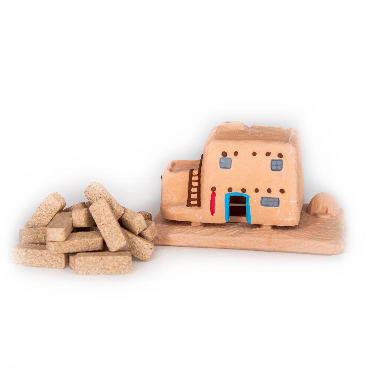 Handcrafted ceramic incense holder resembling adobe-style house with detailed windows and ladder.