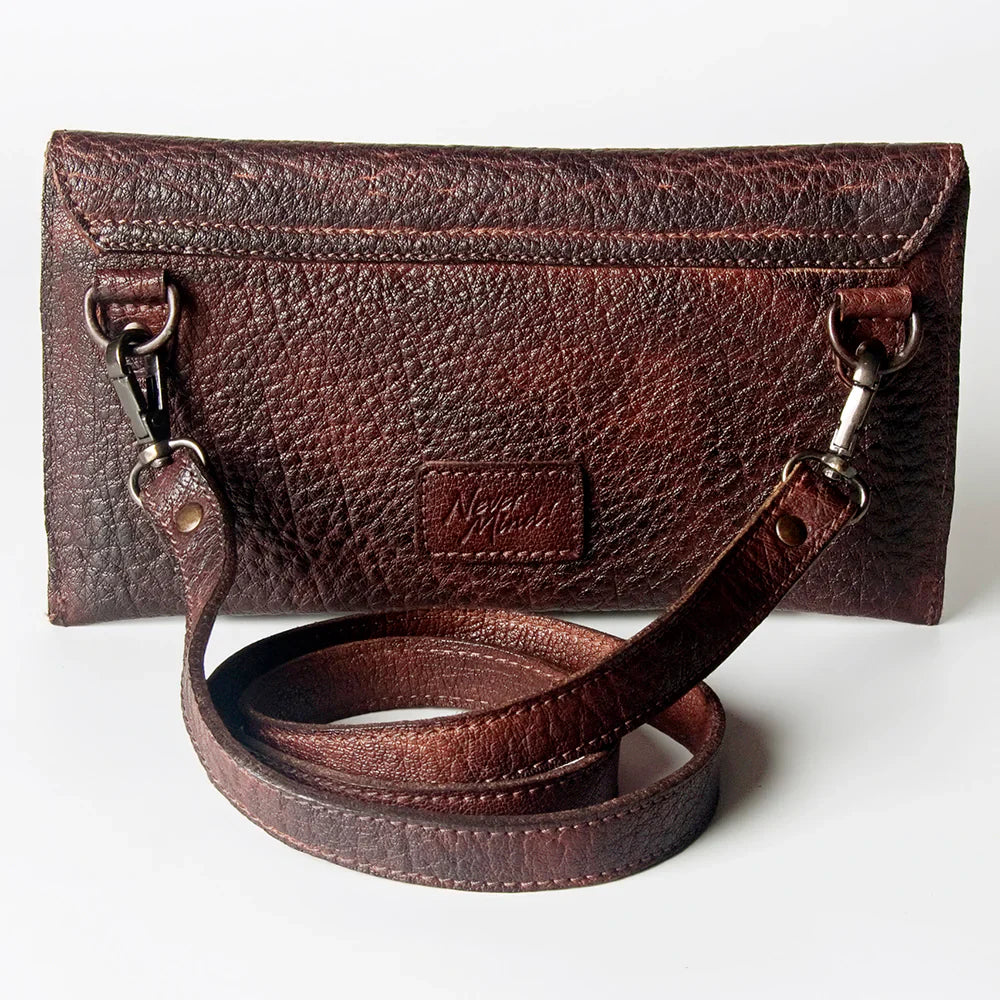 Never Mind Small Crossbody Bag in full grain leather with antique metal fittings and YKK zippers.