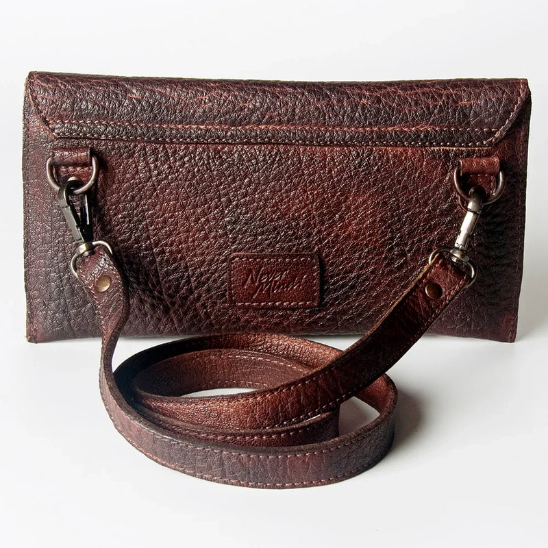 Never Mind Small Crossbody Bag in full grain leather with antique metal fittings and YKK zippers.